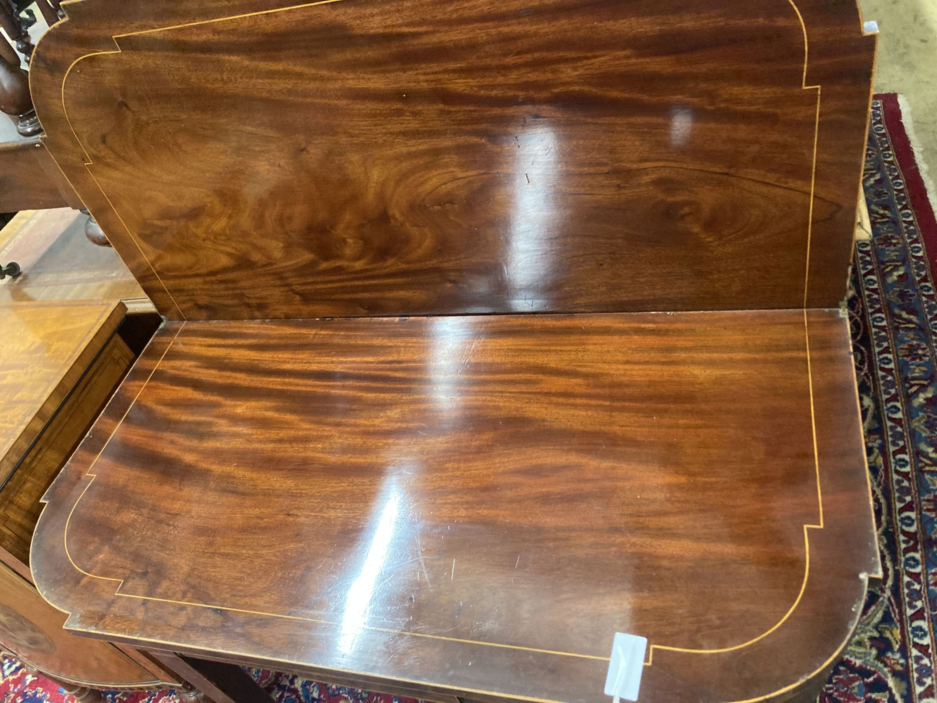 A George IV satinwood banded folding mahogany card table, width 90cm, depth 44cm, height 74cm